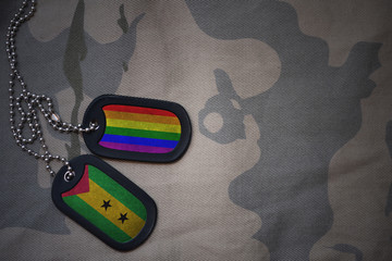 army blank, dog tag with flag of sao tome and principe and gay rainbow flag on the khaki texture...