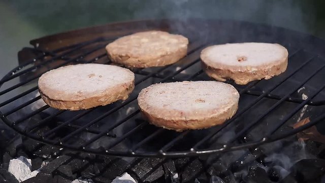 Burgers cooking on a barbecue