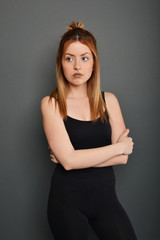 Young brunette lady posing on grey background