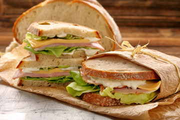 Fresh sandwich with ham cheese lettuce and yogurt sauce