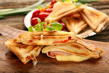 Fresh toast with cheese, ham and tomato