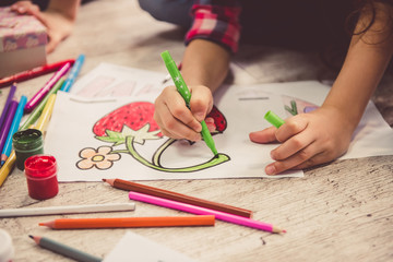 Naklejka premium Children drawing at home