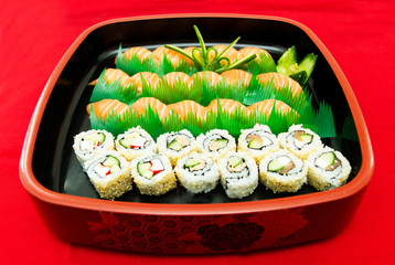 Sushi set roll served in traditional Japan wooden plate.