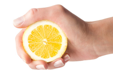 Hand squeezes lemon juice on a white background, isolated