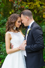 Elegant curly bride and stylish groom