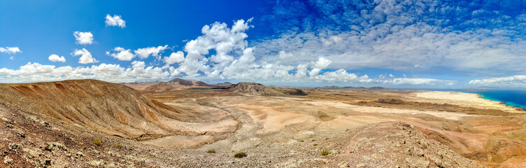 XXL panorama view of Parque Natural de Corralejo (Natural Park of Corralejo) in the northern part of Fuerteventura, Canary Islands, Spain. Seen from Montana Roja mountain. Lobos island in background.