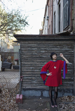 Portrait of young woman standing outdoors