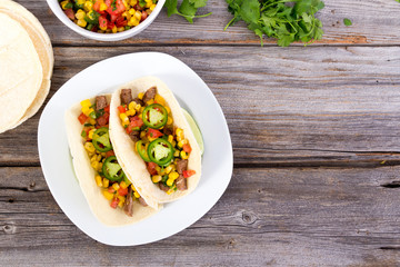 beef corn soft taco on rustic wood table