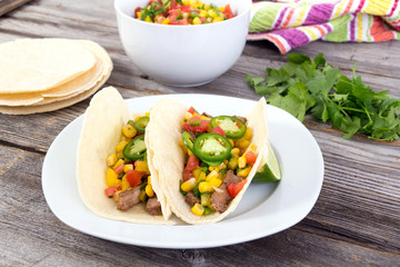 beef corn soft taco on rustic wood table