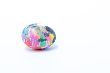 Easter egg hand painted in home - abstract colors pink rosa, green, blue, isolated in white background