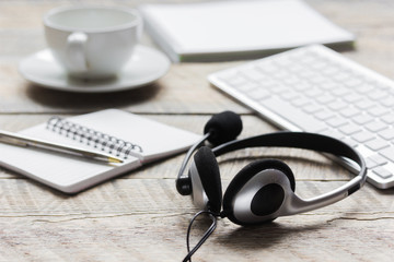 call center manager work desk with headset and keyboard