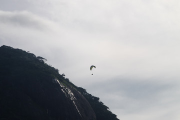 Paraglinder between Pedra da Gavea and Pedra Bonita mountains, R