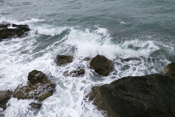 rocks and sea shot on cloudy day