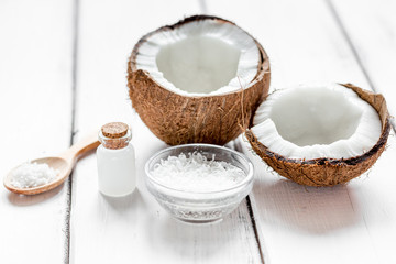 Fototapeta na wymiar coconut oil for body care in cosmetic concept on white desk