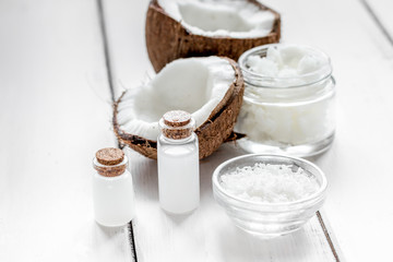 coconut oil for body care in cosmetic concept on white desk
