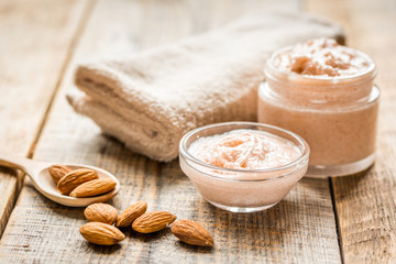 natural scrub with almond on wooden table background