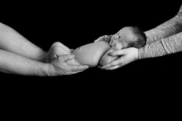Mom and Dad holding their newborn baby boy