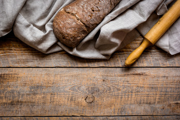 traditional bread with rolling-pin wooden table background top view space for text
