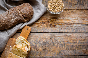 bakery concept with homemade bread on rustic background top view moke-up