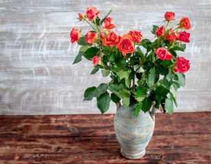Bunch of fresh rose flowers on wall background mock up