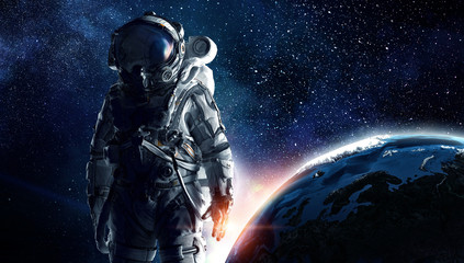 Fototapeta na wymiar Astronaut in outer space. Mixed media . Mixed media