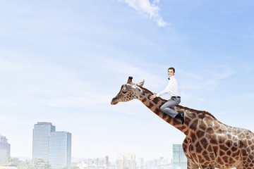 Obraz premium Man ride giraffe . Mixed media