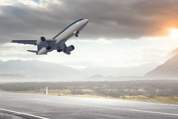 Fototapeta na wymiar Airplane over runway. Mixed media . Mixed media