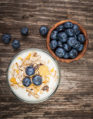 Cornflakes with yogurt and blackberries , top view of healthy breakfast