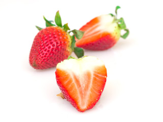 Red strawberries on white background.