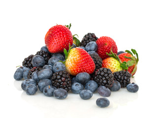 Blackberries, blueberries and stawberries on white background.