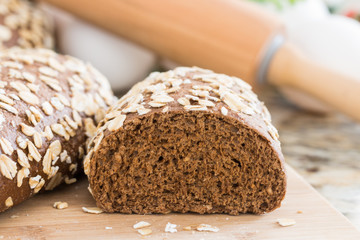 healthy wholemeal bread, on marble table.