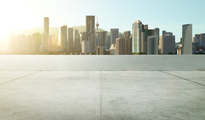 Obraz na płótnie Canvas Empty roof top carpark with modern city skyline , morning sunrise scene .