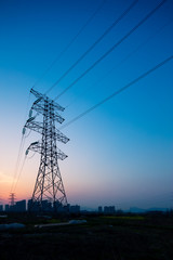Fototapeta premium pylons in blue sky at sunrise