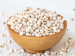 Millet on wooden bowl..