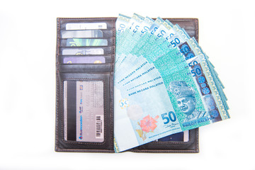 bank note of Ringgit Malaysia and wallet