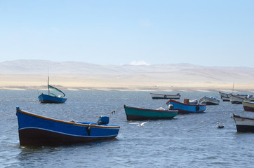 Fototapeta premium View to the fisherman boats, sea and desert
