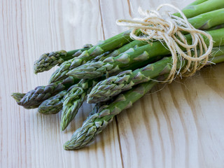 Orgarnic fresh asparagus on wooden block