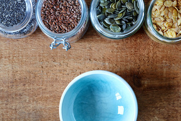 empty bowl and variety of muesli organic nutrition