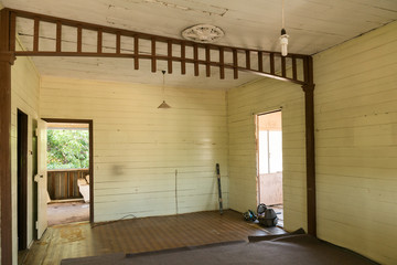 Old Queenslander house needing renovation, peeling paint interior