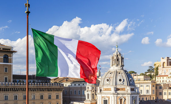 Italian flag on the background of the Cathedral and the blue sky