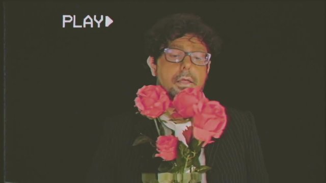 Fake VHS tape: an old man, apparently shy, offers a handful of red roses to the viewer. Useful for Valentine's day, dating, anniversary et al.
