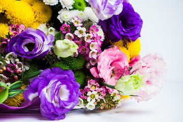Bouquet with a lot of different flower on the wooden background. Shallow depth of field.