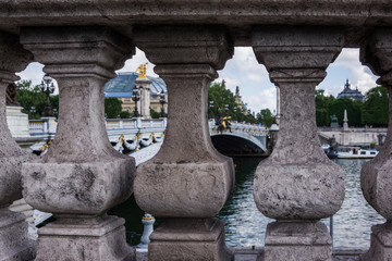 Columns at the side of Pont Alexandre III bridge in Paris, France