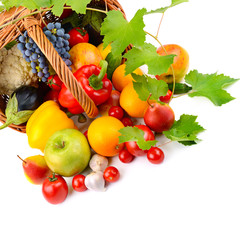 vegetables and fruits in a basket isolated on white background