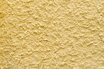 Light yellow rough cement wall concrete texture backgrounds of grunge styled exterior wall building pattern
