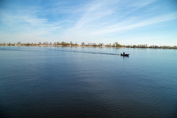 water landscape with Islands and a boat in movement