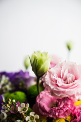 Bouquet with a lot of different flower on the wooden background. Shallow depth of field.