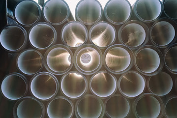 background of colorful big plastic pipes used at the building site.