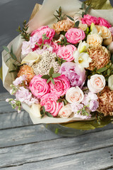 Vintage dark grunge wood texture with empty space decorating by old rose and mixed flowers sweet romantic concept