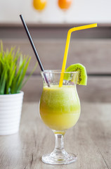 Kiwi cocktail glass on wooden table